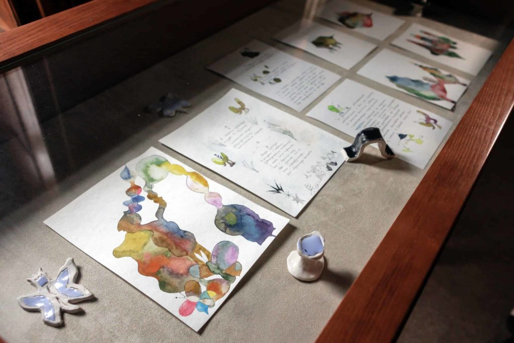 Artists' works laid out on a table