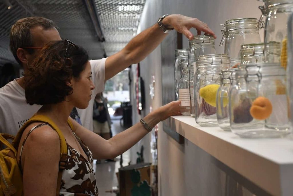 Visitors looking at objects on display at an exhibition