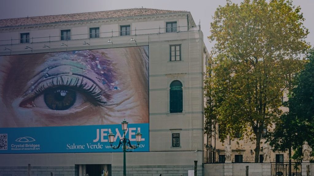 A building in Venice with a monumental image of an eye on its façade